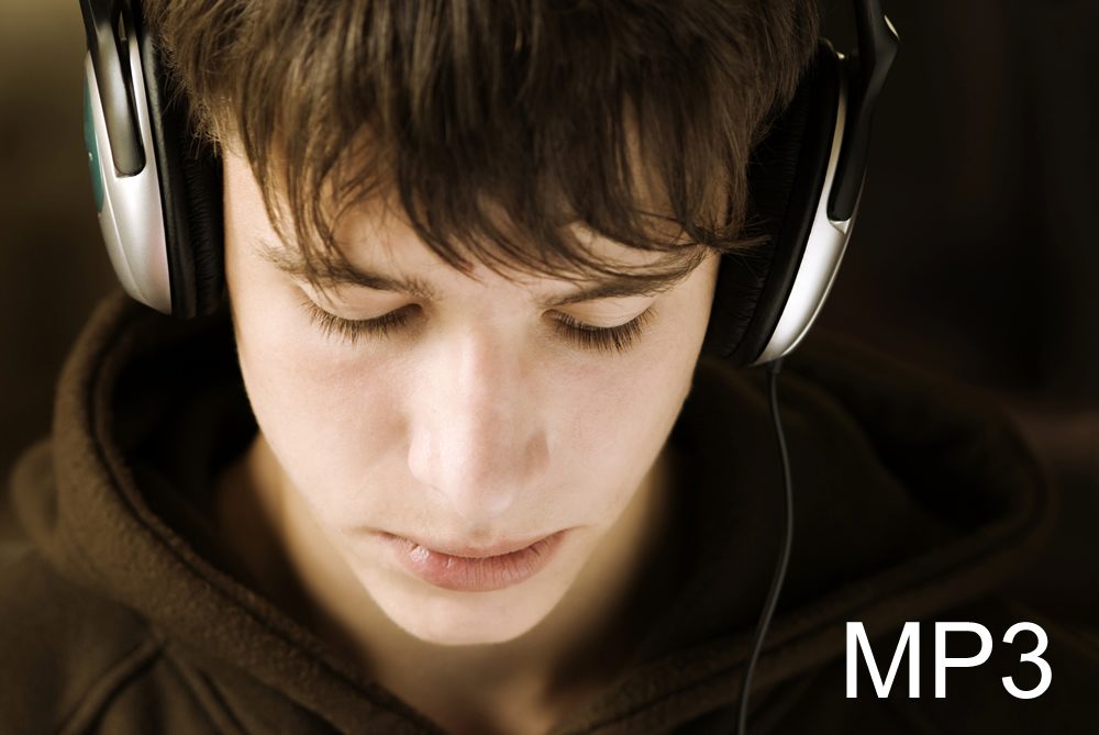 A person relaxing with headphones, eyes closed